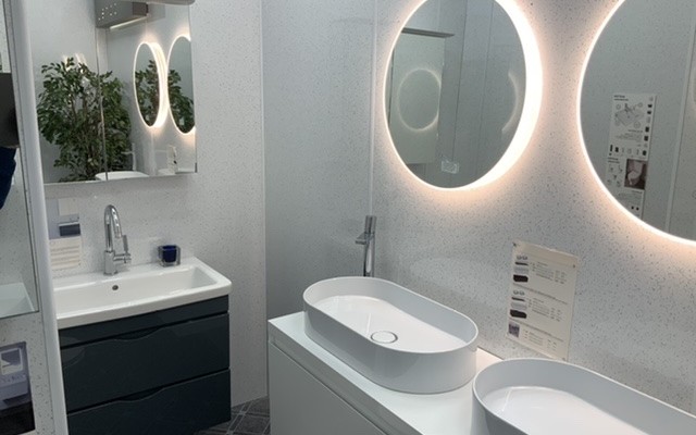 09 - Portsmouth Plumbing Supplies - Bathroom Showroom - Round LED Mirrors above a Wall-Hung Double Vanity Unit